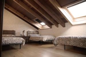a room with four beds in a room with a window at La Casona del Tormes in Almenara de Tormes +58 photos