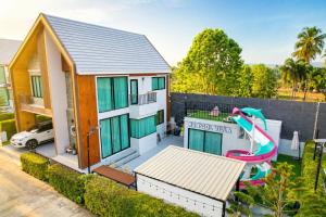 a house with a pool and a slide at K2 Pool Villa Khaoyai in Ban Sap Setthi