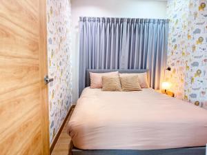 a bedroom with a bed with a white bedspread at K2 Pool Villa Khaoyai in Ban Sap Setthi +62 photos