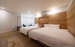 Llit o llits en una habitació de gimhae samgye next hotel