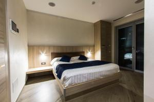 Voodi või voodid majutusasutuse Mito Hotel toas