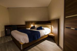 Voodi või voodid majutusasutuse Mito Hotel toas