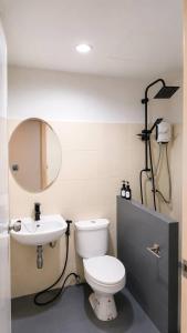 a bathroom with a toilet and a sink at La Vie Résidence in Chiang Mai +14 photos