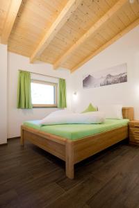 a bedroom with a large bed in a room at Alps 3000-2 in Umhausen