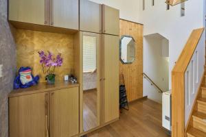 a room with a wooden cabinet with flowers on it at Sapporo Vacation Home B&B in Sapporo +92 photos