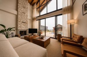 a living room with a couch and a fireplace at Voger Sapanca Lake View in Sapanca