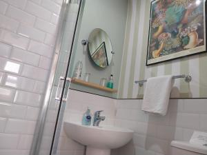 a bathroom with a shower and a sink at Castle Vale House in Berwick-Upon-Tweed +30 photos