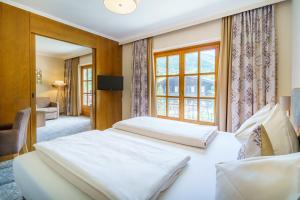 a bedroom with two beds and a window at Kolmhof in Bad Kleinkirchheim +98 photos