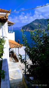 a view of the ocean from a house at Waves of Millos in Skopelos Town