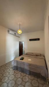 a bedroom with a bed in a room at Anugerah's House in Katiet