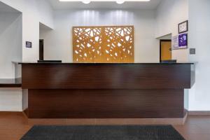 a view of the front desk of a hospital lobby at Sleep Inn Garner - Clayton in Edmondson +40 photos
