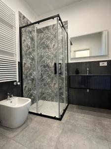 a bathroom with a shower with a tub and a sink at Residenza del Lago in Viverone