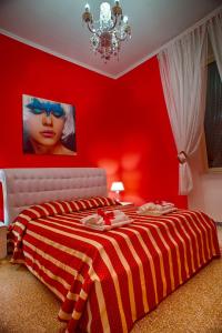 A bed or beds in a room at Guest House Biondi