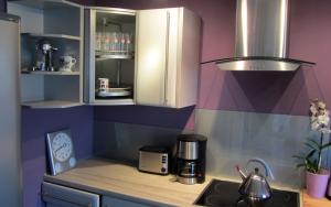 a small kitchen with a counter and a sink at Cologne Apartment – City, Trade Fair, E-Werk in Cologne