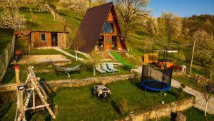 an aerial view of a house on a hill at Căsuța de pe Vale in Sighetu Marmaţiei