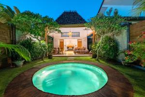 a swimming pool in the yard of a house at Bingin Villas Luxury, Concierge and Security in Uluwatu