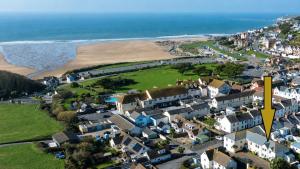 an aerial view of a town with the beach at Surfside in Woolacombe