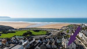 an aerial view of a town and the beach at Studio 5 in Woolacombe