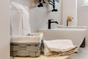 a bathroom with towels on a counter next to a sink at Terrazza del Pittore in Gioia del Colle +59 photos