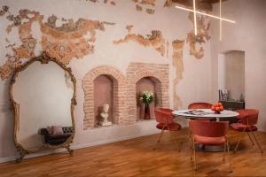 a room with a table and a map on the wall at NH Collection Palazzo Verona in Verona +73 photos