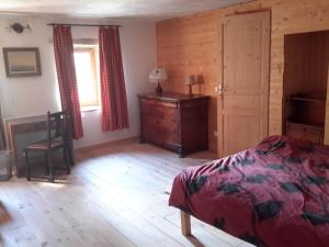 a bedroom with a bed and a dresser and a window at Casa Arnera in Andon +23 photos