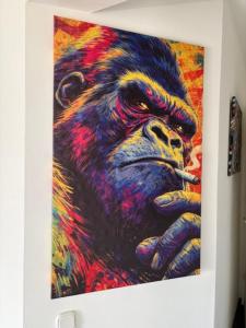 a painting of a gorilla smoking a cigarette at Appartement am Peterstor in Montabaur