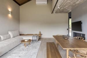 a living room with a couch and a table at Krasnyk Resort in Verkhovyna
