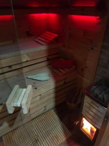 an inside view of a sauna with red lights at Pod Milanem in Przemyśl