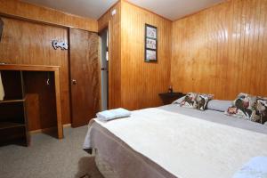 Rúm í herbergi á Casa Chilhué - Hostal Residencial