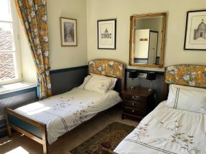 a bedroom with two beds and a mirror at La Grange Terrou in Saint-Germain-de-Confolens +65 photos