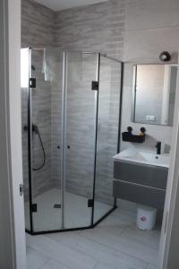 a bathroom with a shower and a sink at Siorica Beach in Matalascañas +14 photos