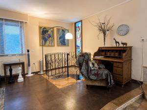 a living room with a desk and a chair at Peaceful Retreat - Kefalos Stay with Patio views & gym in Kefalos