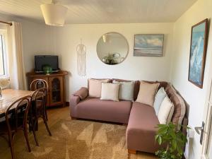 a living room with a couch and a table at Seaview in Duneen
