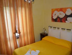 A bed or beds in a room at Casa Magini