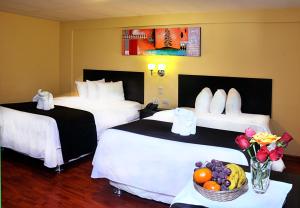 Ein Bett oder Betten in einem Zimmer der Unterkunft Casona Plaza Hotel Centro