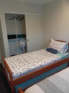 a bedroom with a bed and a window at 111 3rd Avenue Tauranga in Tauranga +8 photos