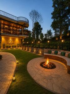 a fire pit in the middle of a courtyard at Heritage Resort's Jageshwar in Jageshwar