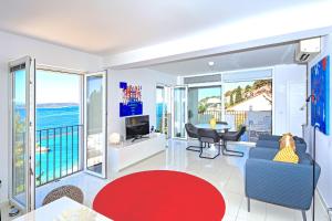 a living room with a view of the ocean at Blue Bay Residence in Hvar