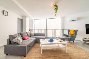 a living room with a couch and a table at Secret Garden in Vias