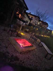 a fire pit in the middle of a yard at night at Chalet Maier in Landschach