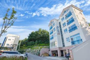 a building with a car parked in front of it at Samcheok eastocean in Samcheok