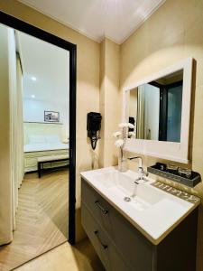 a bathroom with a sink and a mirror at Khách sạn Solea VIỆT TRÌ in Việt Trì +54 photos