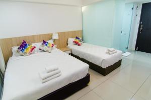 Ένα ή περισσότερα κρεβάτια σε δωμάτιο στο Mornington Hotel Waterfront Lumut