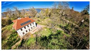 an overhead view of a white building with a red roof at podZZamkem in Jaroslavice