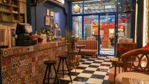 a bar with a checkered floor in a restaurant at Beauty House in Ho Chi Minh City