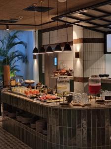 a buffet in a restaurant with food on a table at The Nordic Abuja in Abuja