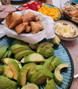 a table filled with different types of food on plates at Riad Alaya, Rooftop Pool & Koutoubia View in Marrakesh +169 photos