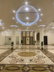 a lobby with a large room with a large ceiling at ڤيا Via in Buraydah