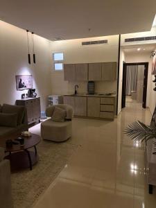a living room with a couch and a table at ڤيا Via in Buraydah