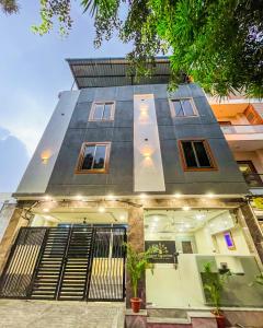 a house with a staircase in front of it at Hotel Prime Access Inn in Indore